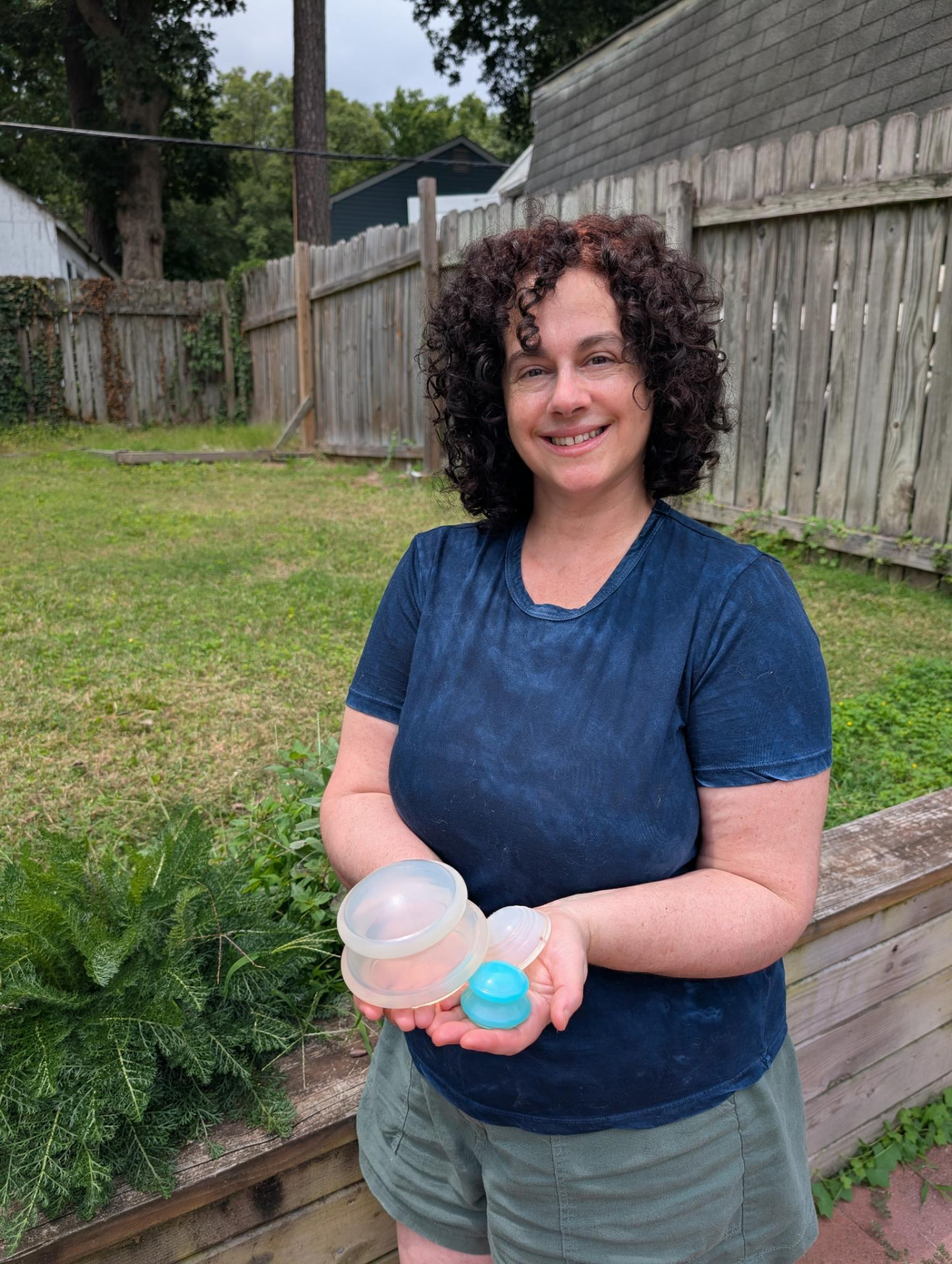 Lily Kandaris holding silicone cupping sets outdoors